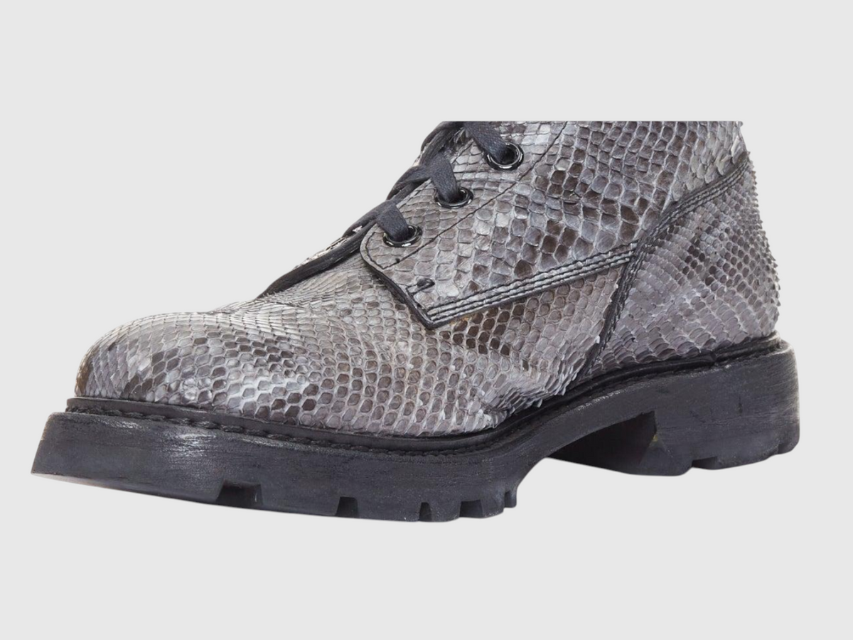Close-up of men's python leather boot and lug sole