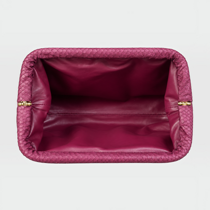 Intérieur d'une pochette Genuine Skins en cuir de python violet prune avec fermoir doré et doublure en cuir lisse