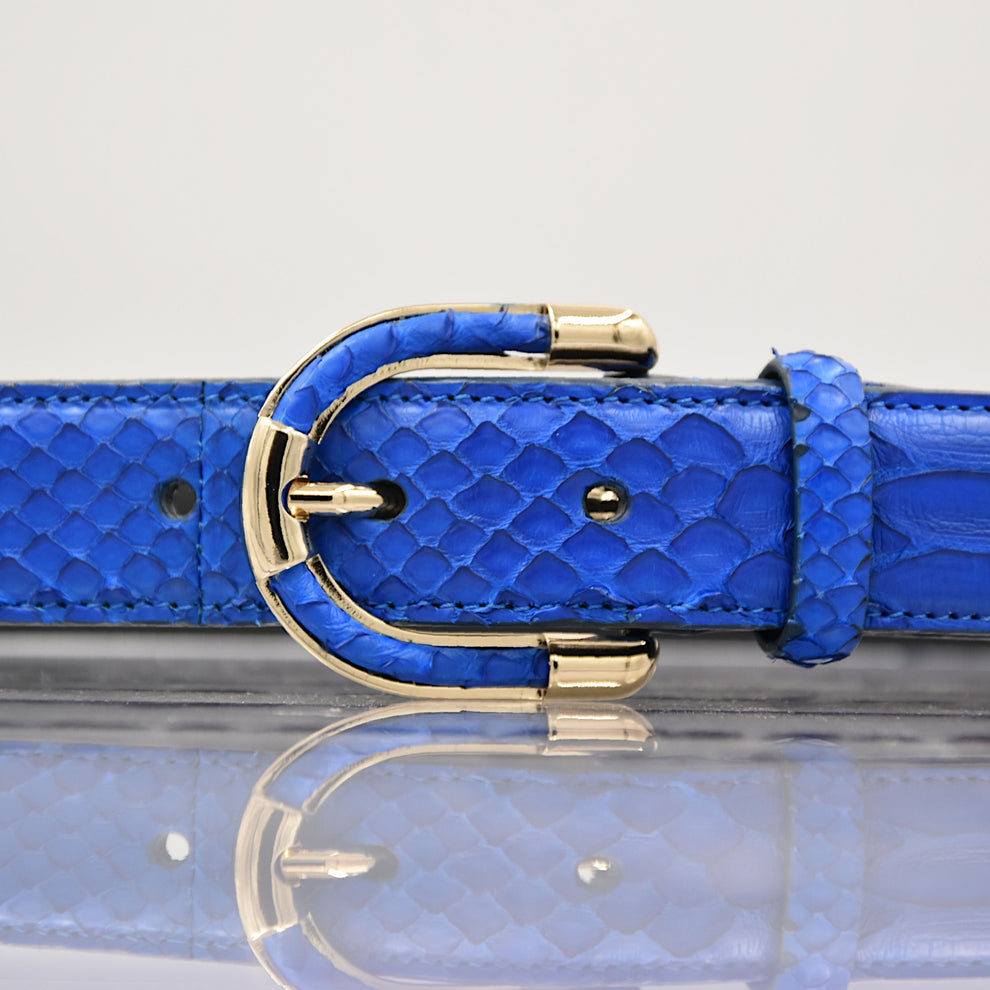 Close-up of women's genuine royal blue python leather belt and buckle