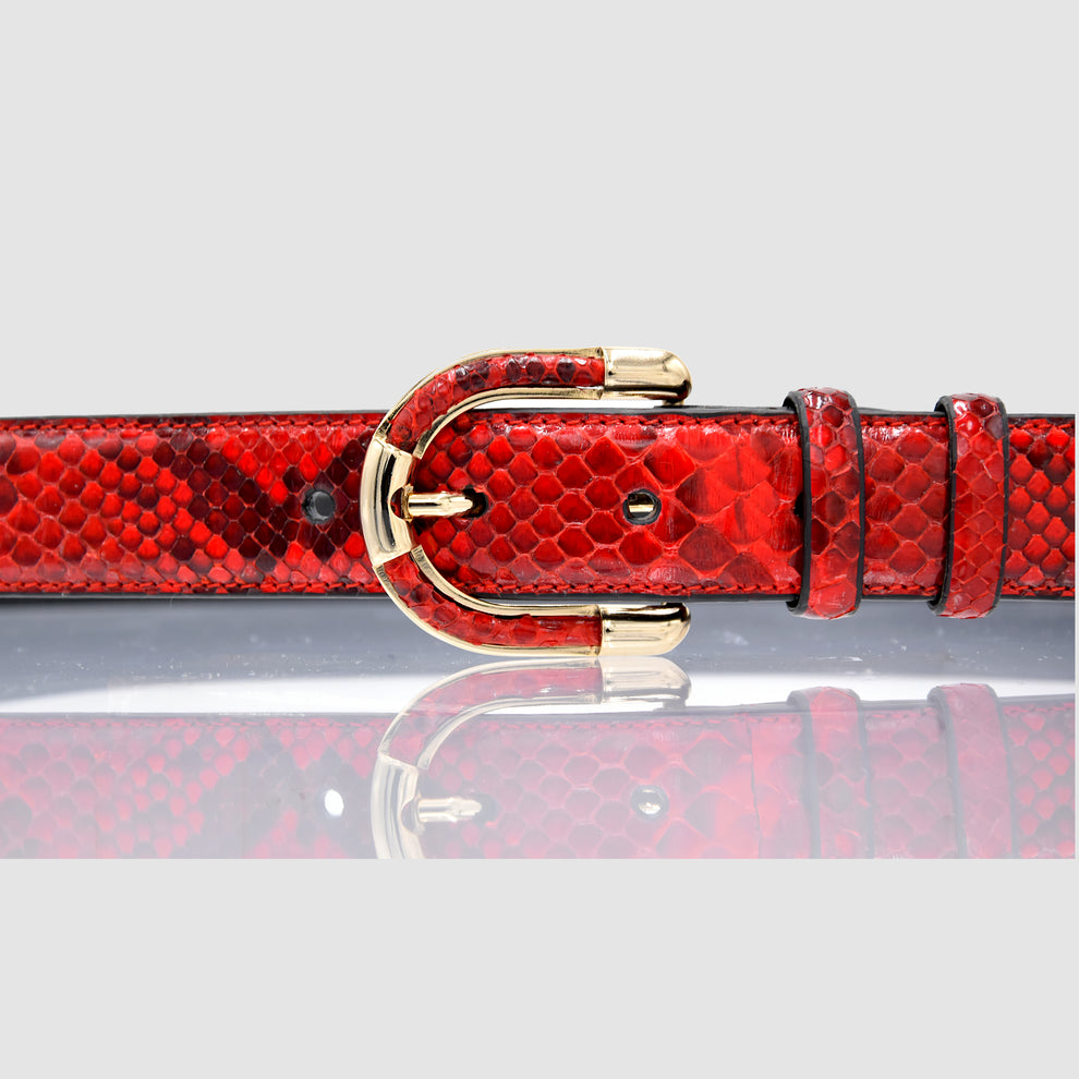 Close-up of women's genuine red python leather belt and buckle