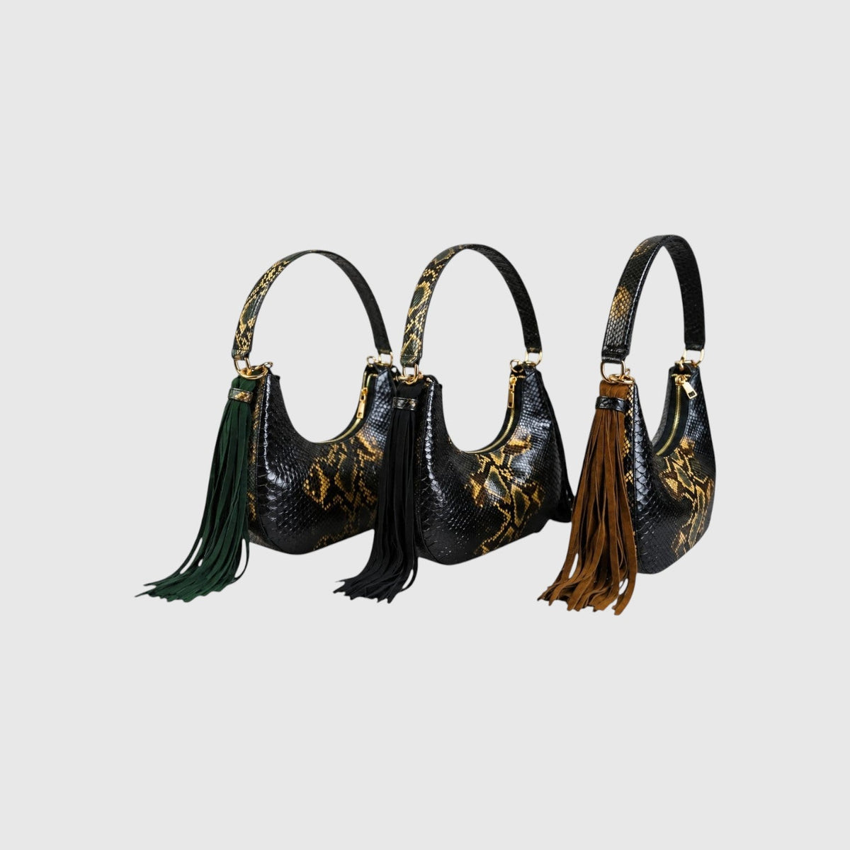 Trois sacs hobo Fofana Bag par Leather craftman en cuir de python noir et jaune avec pompons en daim colorés