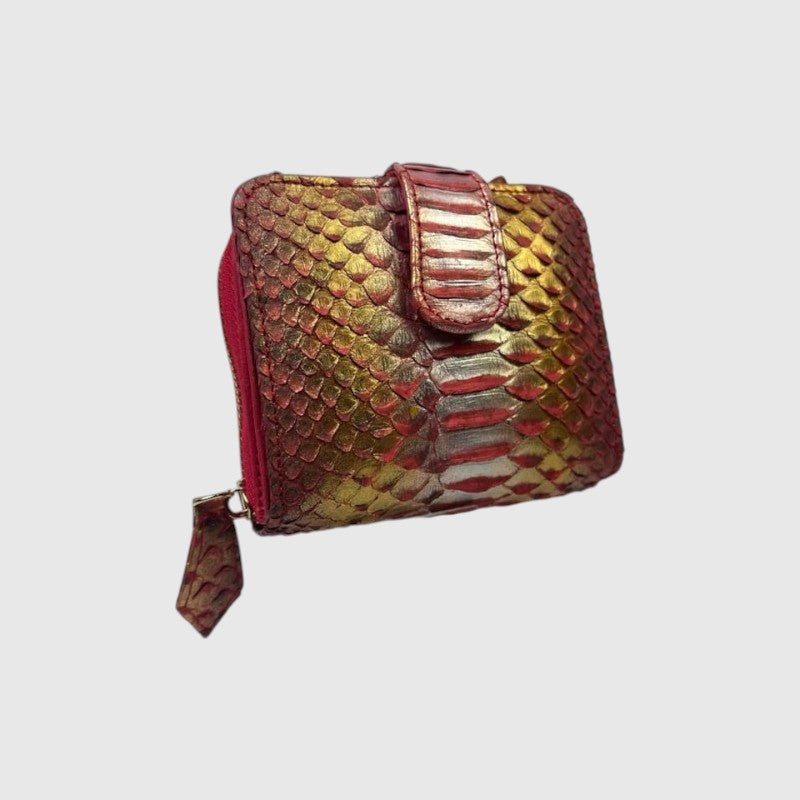Portefeuille Leather craftman en cuir de python véritable avec des reflets dorés et rouges et une fermeture zippée.