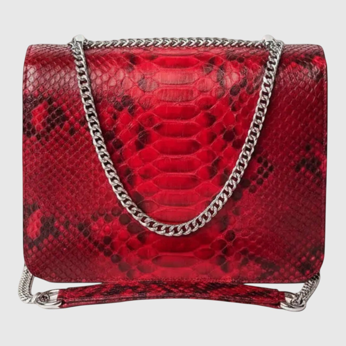 Sac à bandoulière Leather craftman en cuir véritable rouge rubis avec texture python et chaîne métallique argentée.