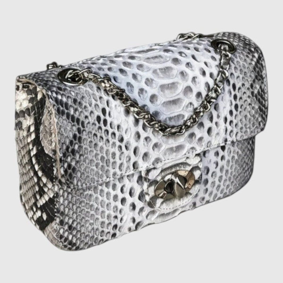 Sac à bandoulière Leather craftman en cuir véritable avec texture python, chaîne métallique et fermoir tournant.