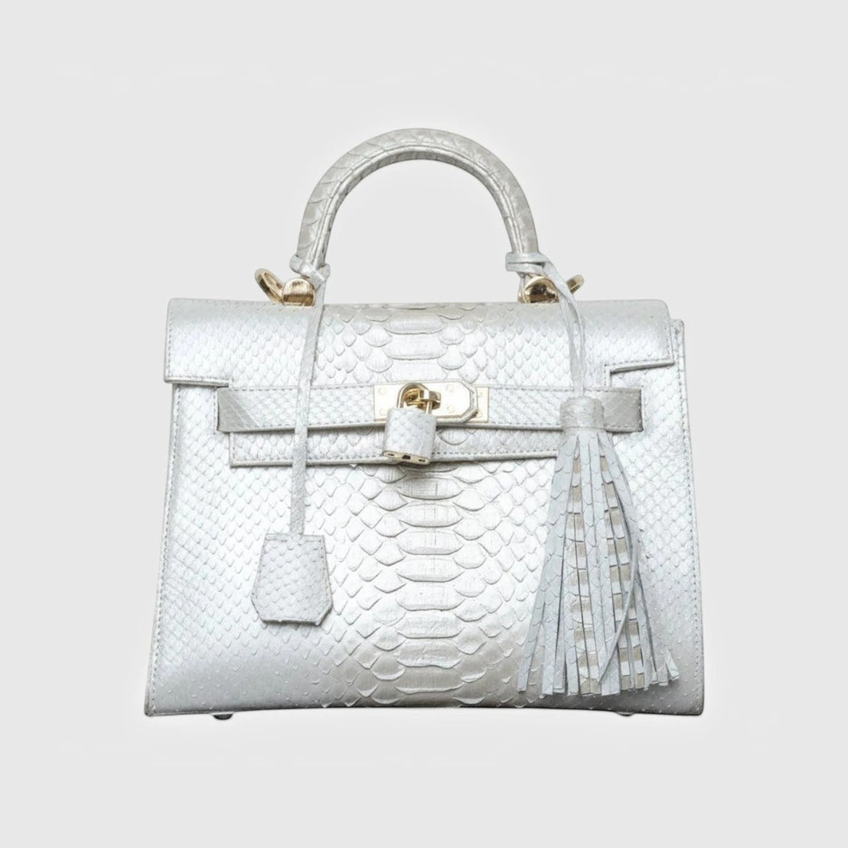 Sac à main Leather craftman Snow Python en cuir de serpent blanc avec détails en métal doré et pompon décoratif
