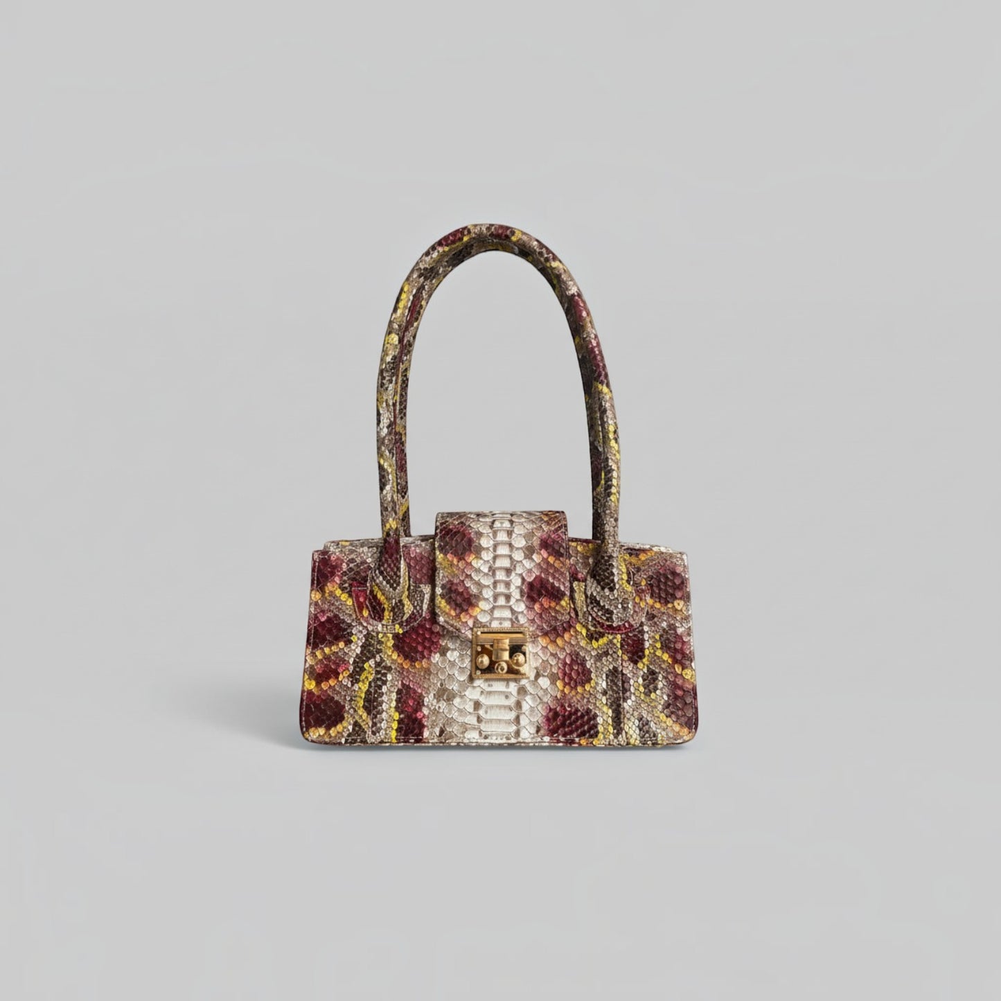Sac à main Leather craftman Serpentina Rubis en cuir de python multicolore avec fermoir doré et anses structurées