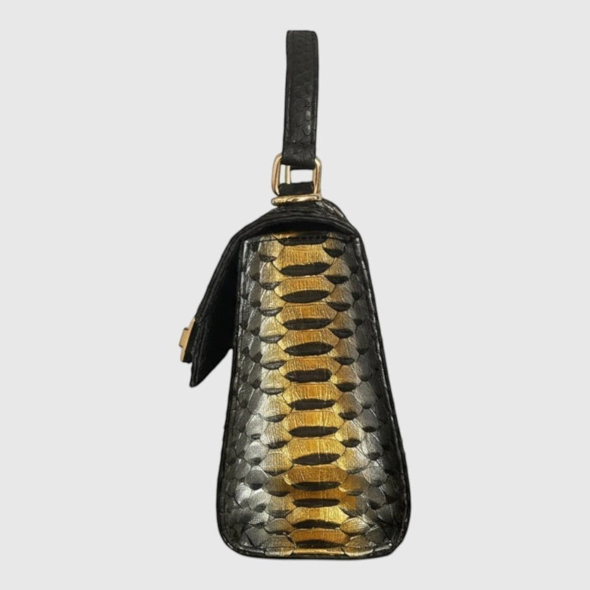 Sac à main Leather craftman Midnight Gold en cuir de python noir avec une épine centrale dorée et poignée supérieure
