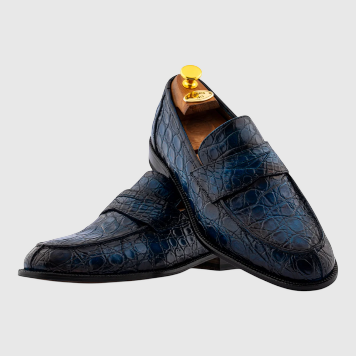 Men's hand-painted genuine crocodile leather loafers in blue, angled view