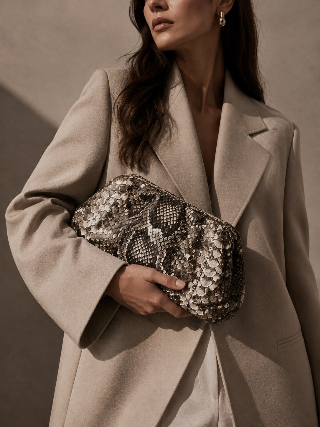 Clutch en python exotique — campagne Genuine Skins
